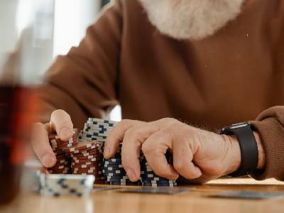 bearded man pushing many chips forward